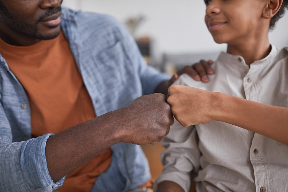Father and Son Fist Bump - Child Custody Lawyer in Westlake Village Graphic
