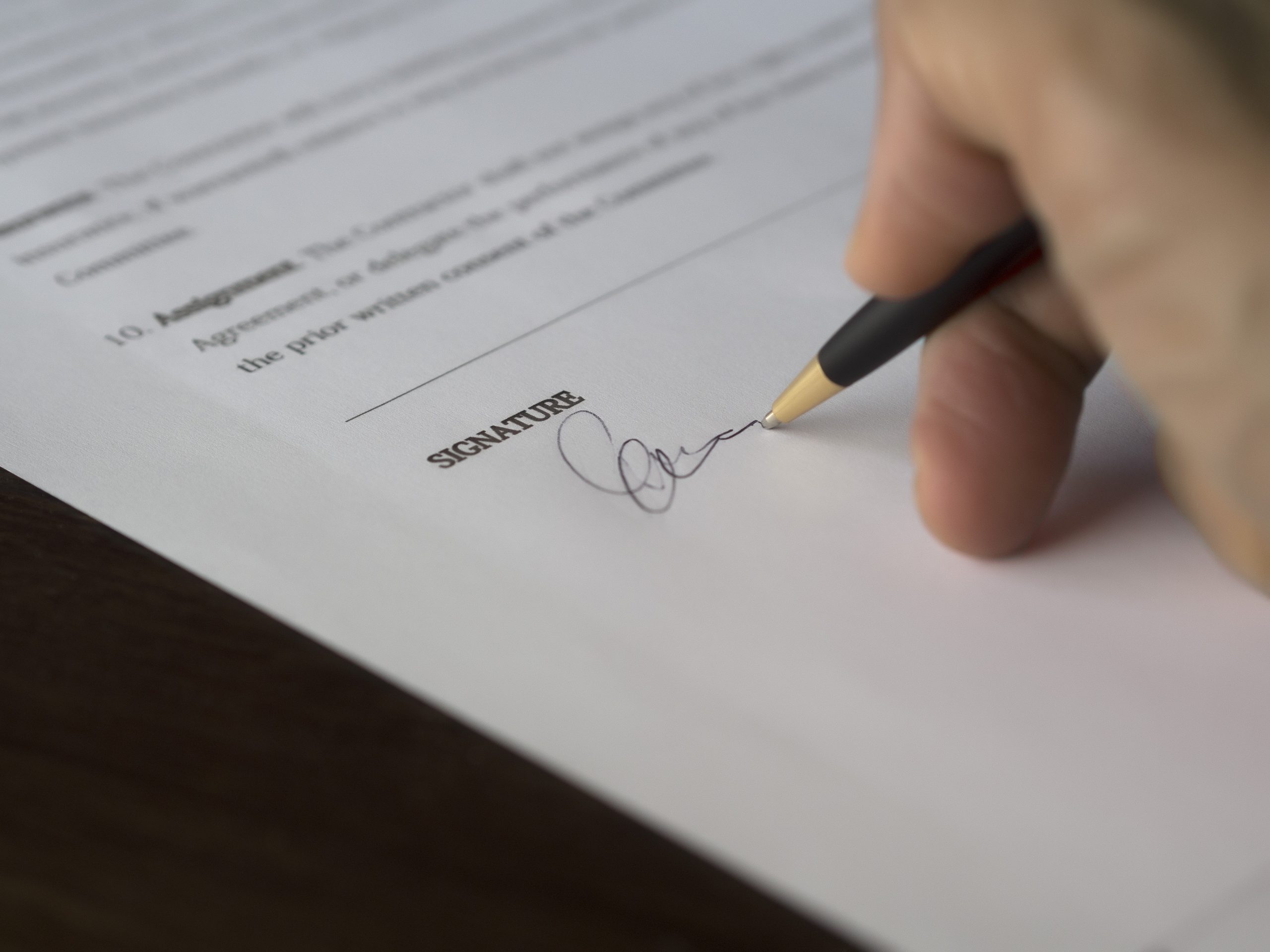 Writing a Signature - What Happens After Divorce Mediation Settlement Blog Graphic