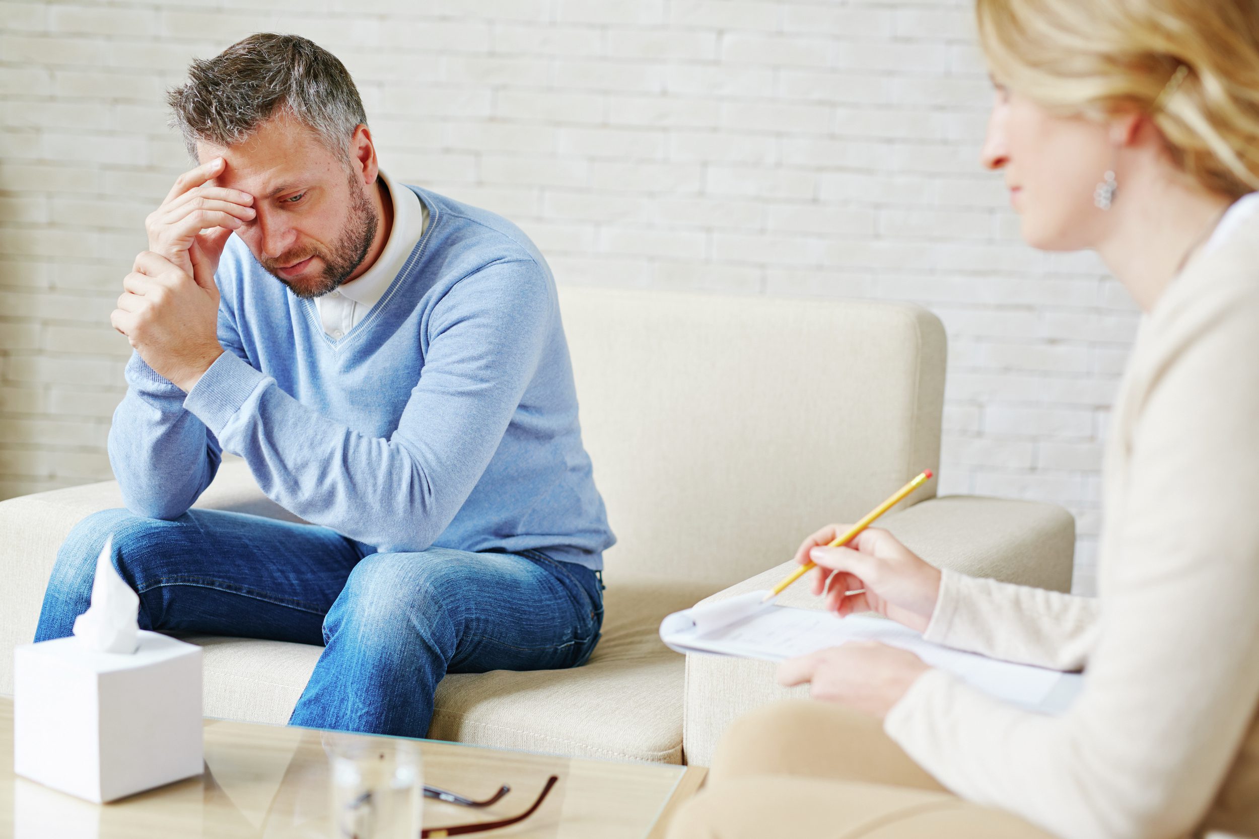 Man talking to psychologist